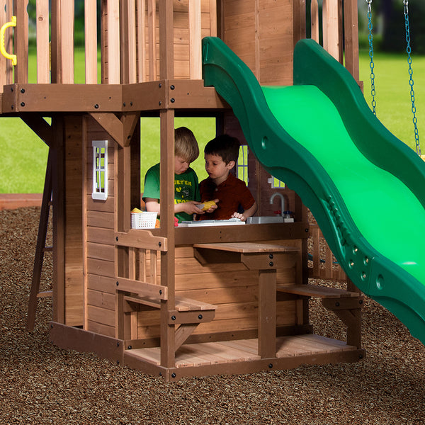Endless Hours of Fun Provide hours of entertainment with a grill, plastic food, and a four-person picnic area alongside swings and a trapeze.