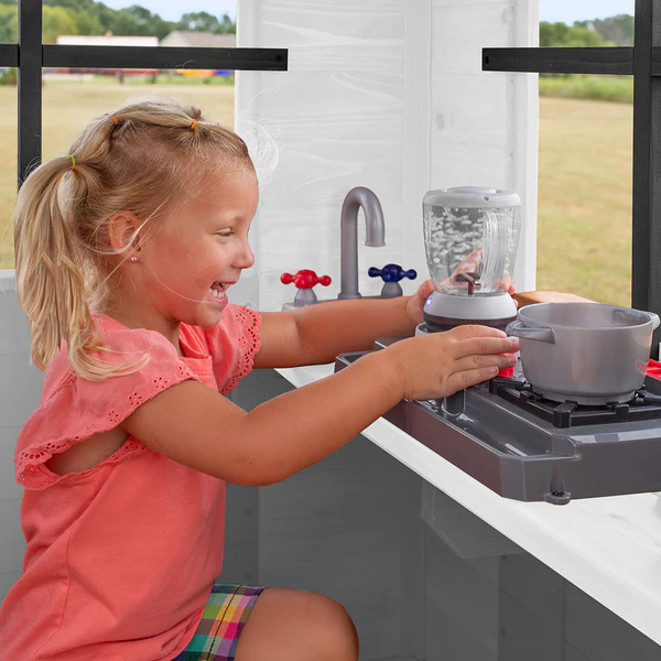 Sink, Stove, and Doorbell A tiny baker's gourmet kitchen.