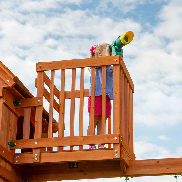 The standout feature is the crow’s nest with a telescope that always sparks adventures. But not to be outdone, just below is a set of monkey bars, a speedy slide, a snack stand, a picnic table, swings, and more.