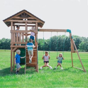 young kids playing. on Lightning Ridge Swing Set