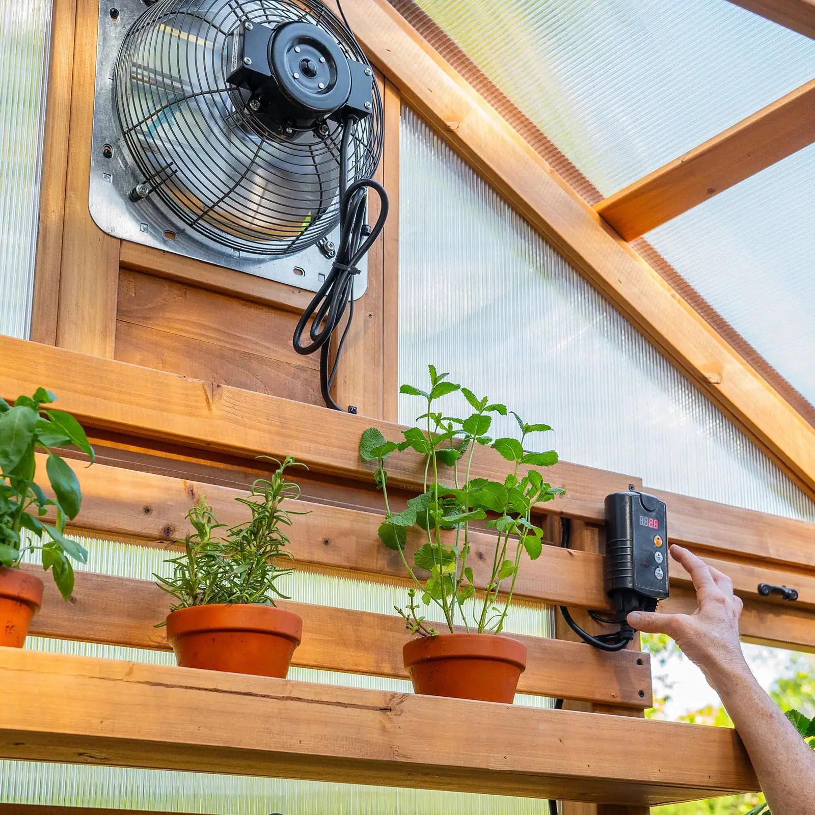 EXHAUST FAN Temperature-activated exhaust fan helps manage rising temperatures to create ideal growing conditions.
