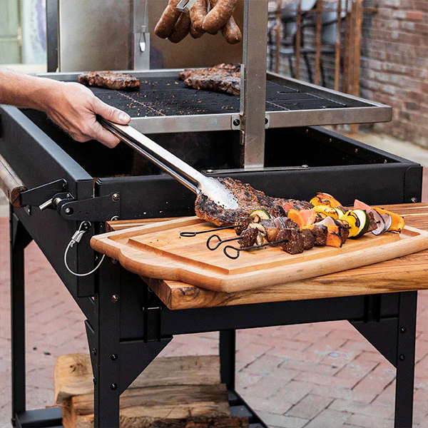 Adjustable Grill Santa Maria-style precision with adjustable grill grates from 2” to 24”, allowing for searing and slow cooking.